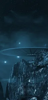Futuristic UFO hovering over dark mountains in a starry night sky.