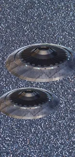 Futuristic metallic UFOs against a starry background.