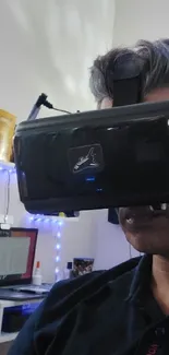 Person using a VR headset in a tech office setup.