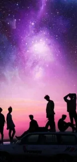 Group silhouette against a cosmic purple sky with stars.