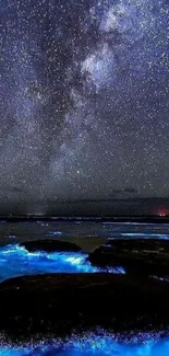 Starry night sky over a glowing bioluminescent ocean.