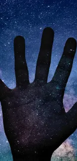 A hand silhouette set against a galaxy full of stars in the night sky wallpaper.