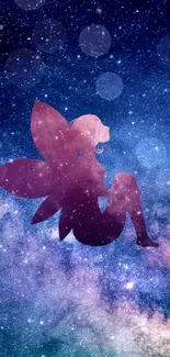 Fairy silhouette against a vibrant galaxy background wallpaper.