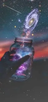 Hand holding a jar with a galaxy under the starry night sky.