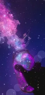 Hand holding jar releasing colorful galaxy into night sky.