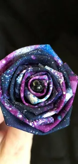 Galaxy-themed origami rose with vibrant colors for mobile wallpaper.