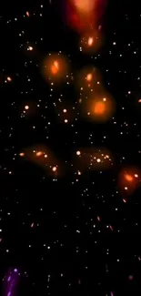 Galaxy sparkle wallpaper with orange lights on a starry black background.