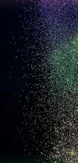 Galaxy sparkles mobile wallpaper with colorful particles on a black background.