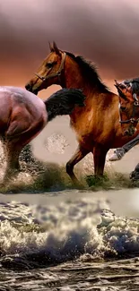 Three horses galloping along a beach at sunset with waves splashing.