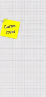 Game Over sticky note on white grid wallpaper.