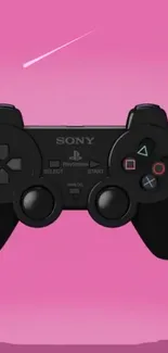 Black gaming controller on a vibrant pink background.