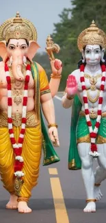 Statues of Ganesh and Hanuman walking along a road.