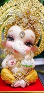 Ganesh doll with golden crown and lotus flower, ornamented in jewels.