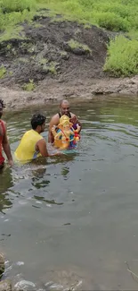 Ganesh idol immersion in a tranquil lake surrounded by lush greenery.