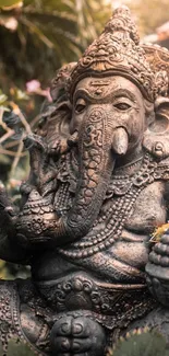 Intricate Ganesha statue amidst lush greenery, perfect for meditation.