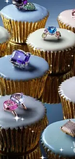 Cupcakes with gemstone rings on a reflective surface.