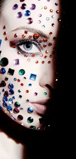 Face with colorful gemstones against a black background.