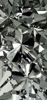 Geometric silver crystal design wallpaper with sharp facets and reflections.