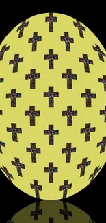 Geometric egg wallpaper with yellow cross pattern on a black background.