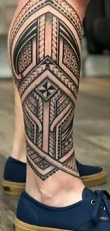 Geometric tribal tattoo on a leg with blue shoes.