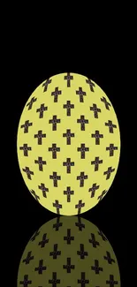 Yellow sphere with black cross pattern on mobile wallpaper.