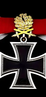 German Iron Cross medal with red and gold ribbon against a black background.
