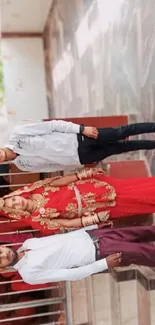 Traditional wedding portrait with red and gold attire.