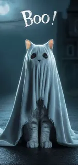 Cute cat dressed as a ghost with 'Boo!' sign under a dark sky.