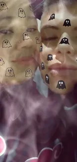 A couple with ghost stickers on their faces, creating a fun and unique wallpaper.