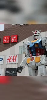 Urban scene with a giant robot statue and brand signage.