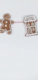 Gingerbread man and house garland on white background.