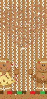 Gingerbread couple with heart pattern on festive striped wallpaper.