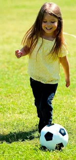 Young girl playing soccer on grass field.