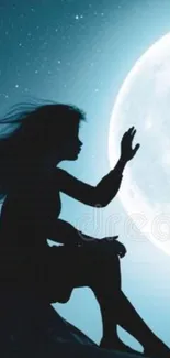 Silhouette of girl reaching towards the moon in a starry night sky.