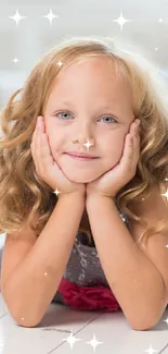 Blonde girl smiling on a bright white floor, surrounded by natural light.