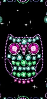 Vibrant gemstone owl design on black wallpaper.