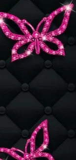 Glamorous pink butterfly wallpaper with sparkles on black.