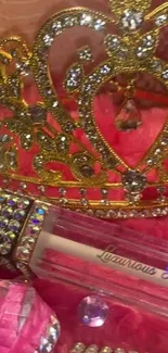 Luxurious golden crown with sparkling jewels on a pink background.