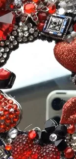 Heart-shaped rhinestone phone decor with a mirror reflection background.
