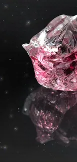 Pink crystal with reflection on a black background, ideal for mobile wallpaper.