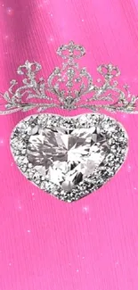 Heart-shaped diamond with crown on pink background wallpaper.