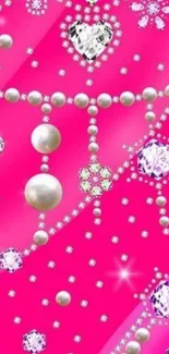 Bright pink wallpaper with sparkling jewels and pearls.