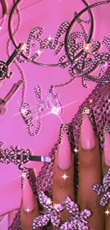 Glamorous pink wallpaper with jewelry and chic nail art.