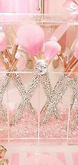 Pink glamorous makeup brushes with rhinestones in a stylish setting.