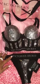 Victoria's Secret lingerie set with pink accessories and bag.