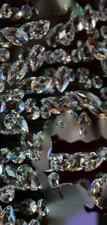 Gleaming crystals with rainbow reflections on a black background for mobile wallpaper.