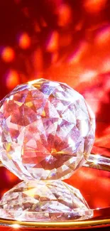 Luminous crystal ball on a scarlet background with vibrant reflections.