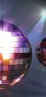 Shiny disco balls with vibrant purple glow.