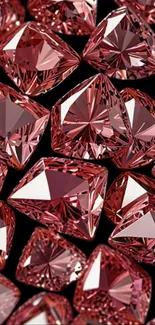 Cluster of red crystals with intricate cuts reflecting light elegantly.