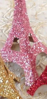 Glitter Eiffel Tower decorations in pink, gold, and red.